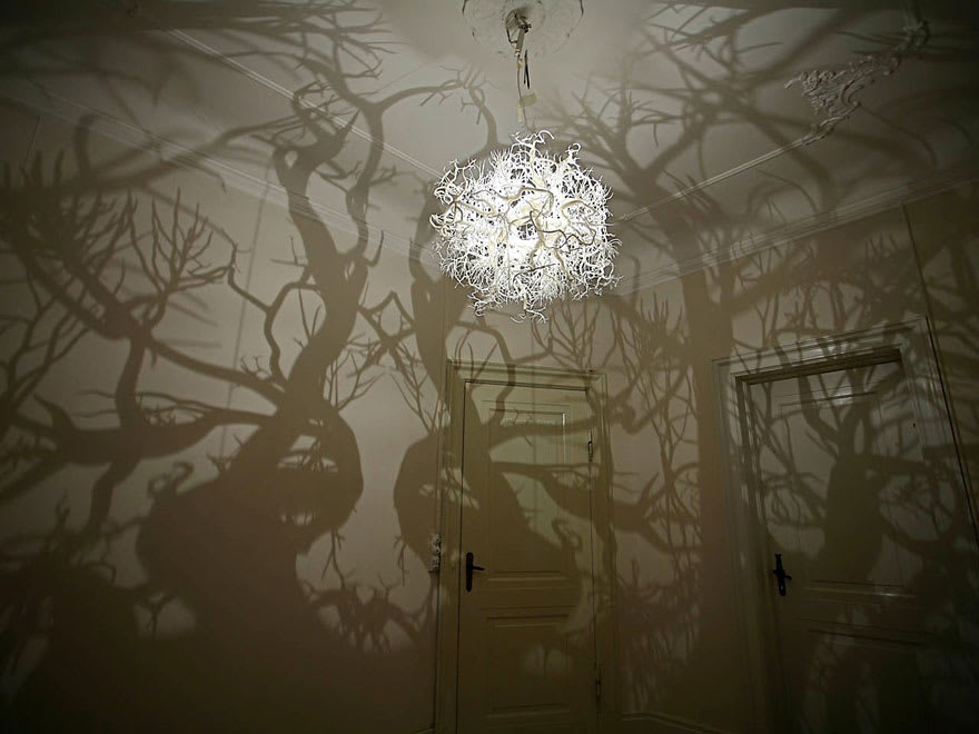 This Hilden Diaz designed chandelier turns your room into a creepy forest scene