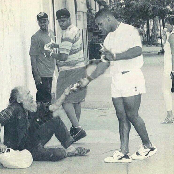 Mike Tyson gives a homeless man money in New York City (1991)