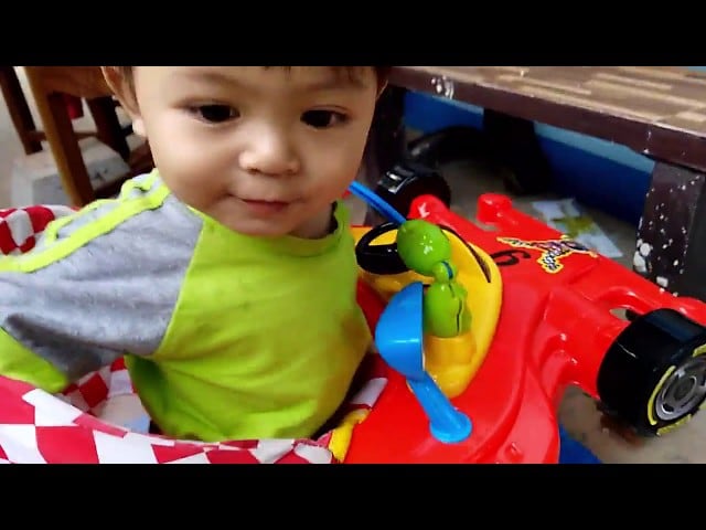 Young baby play with Car