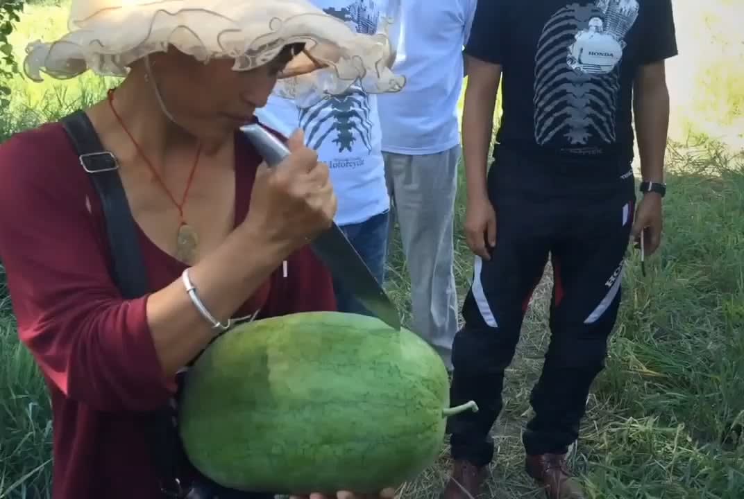 Mongolian way of cutting watermelon