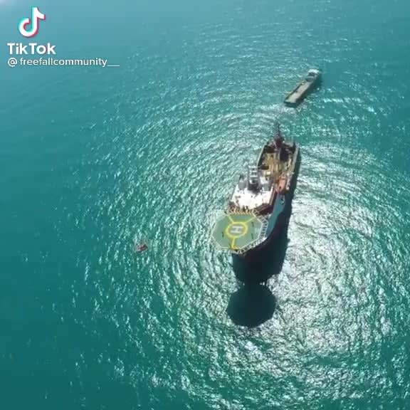 Parachuting onto a moving ship with a helipad
