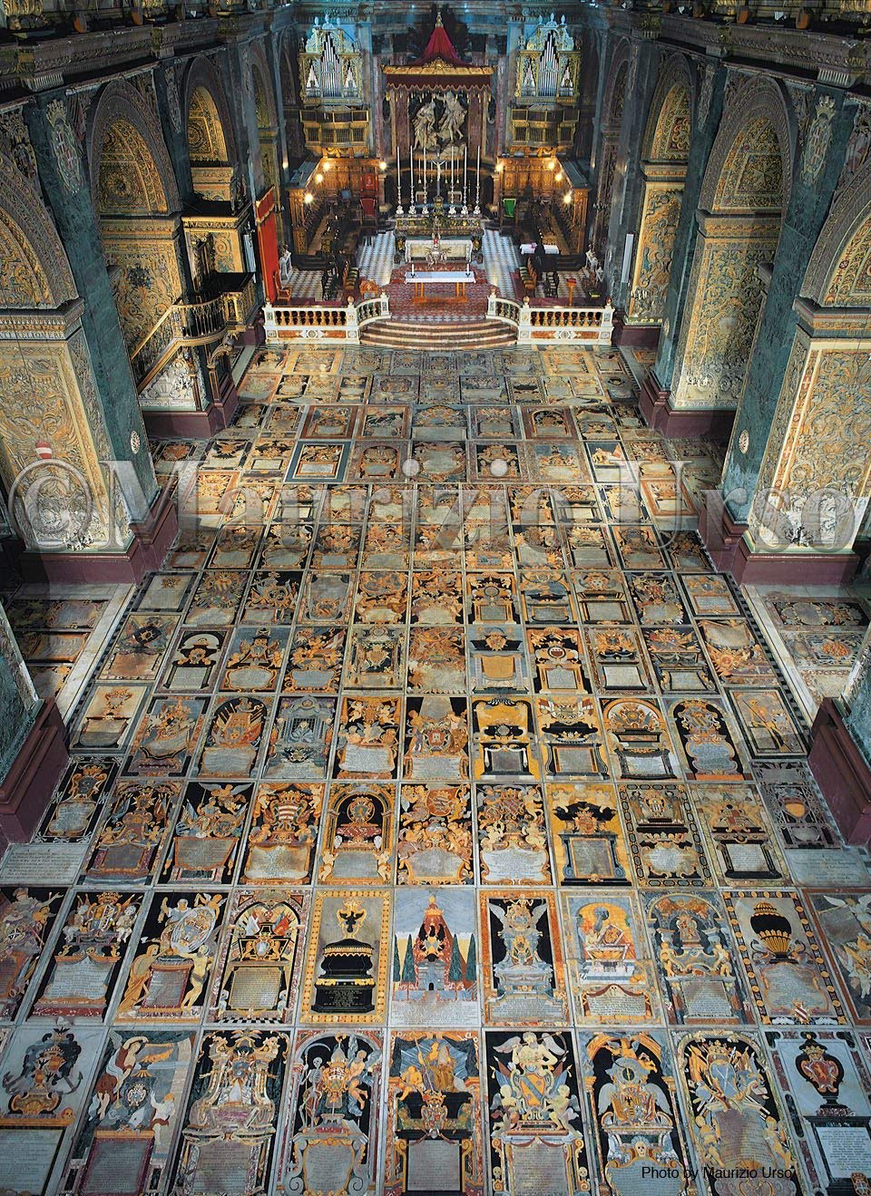 The floor of St. John's Co-Cathedral, in Malta, is composed of nearly 400 tombstones of Knights and officers of the Order of St. John of Jerusalem. Each tombstone is inlaid by a colored marble slab bearing the crest, coat-of-arms and epitaph of the noble knight
