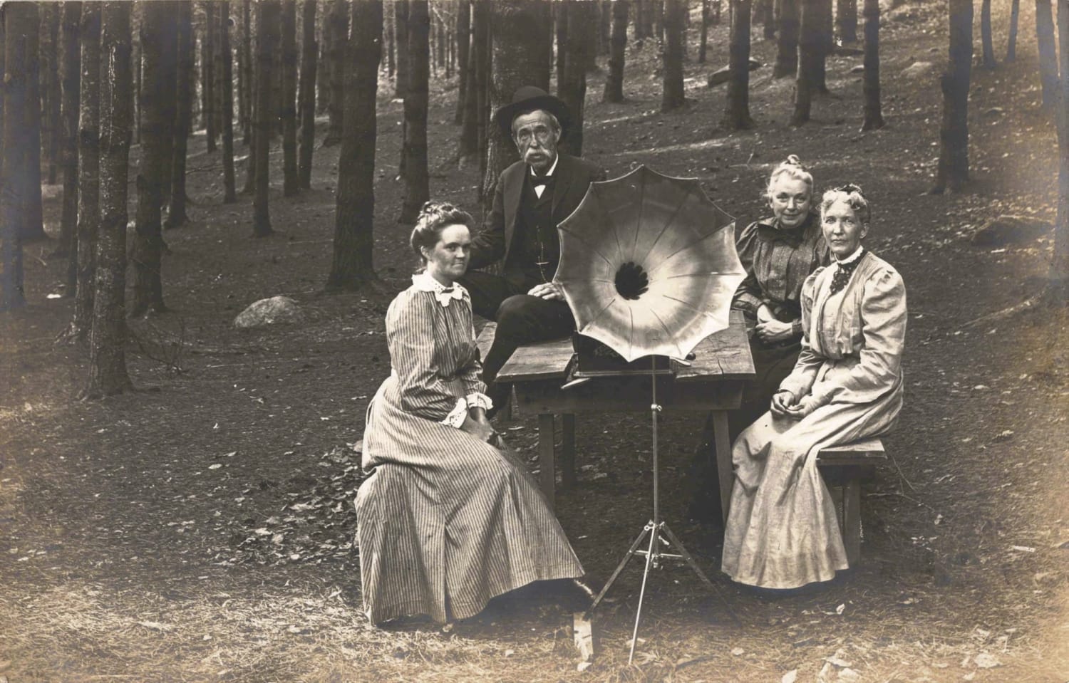 Group of People Posing with a Phonograph in the Woods, circa 1905, Location Unknown