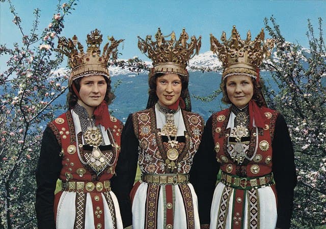 Norwegian women in traditional wedding dresses and crowns, Norway (circa 1960s)