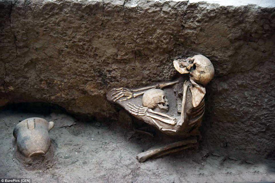 4,000-year-old skeletons of mother and child are found locked in dying embrace in 'China's Pompeii' that was wiped out by a catastrophic earthquake. The discovery was made by experts on the Bronze Age archaeological site in Qinghai province.