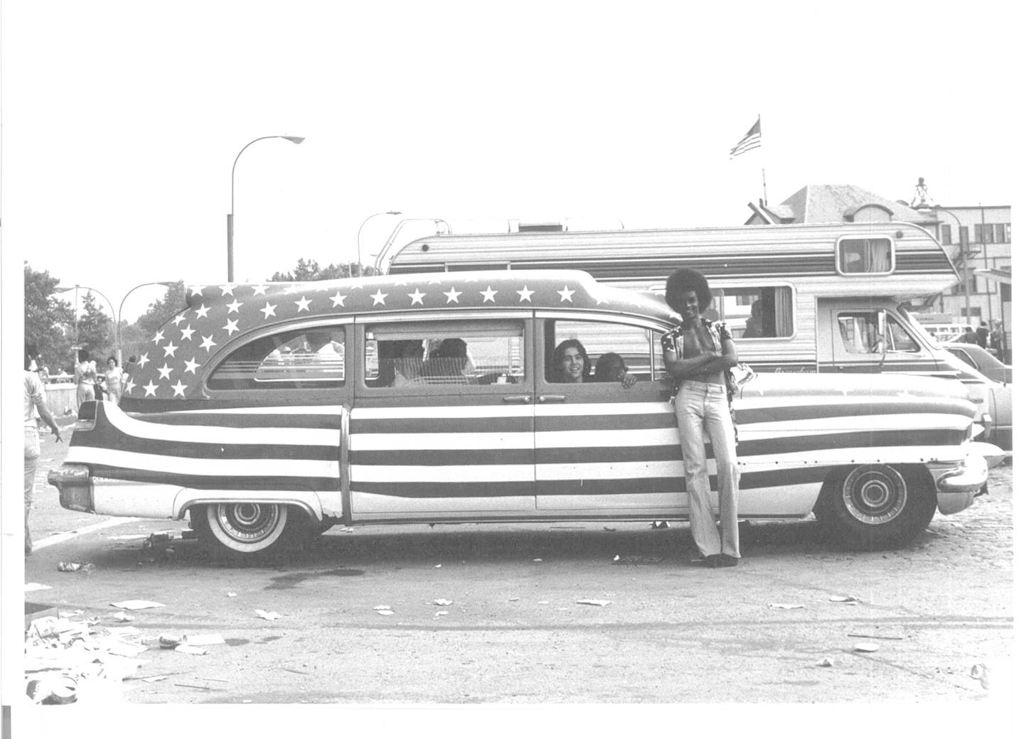 Hippies painted an old ambulance red, white & blue in honor of the Bicentennial Celebration at South Street Seaport, NYC (July 4, 1976). Photo by Sue Berg