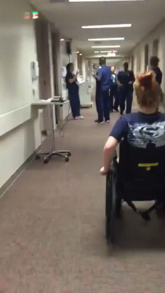 Girl who was temporarily paralyzed visits her nurse.