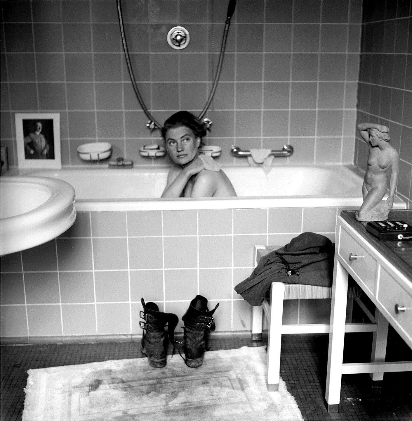 War correspondent Lee Miller taking a bath in Adolf Hitler’s apartment in Munich, 1945.