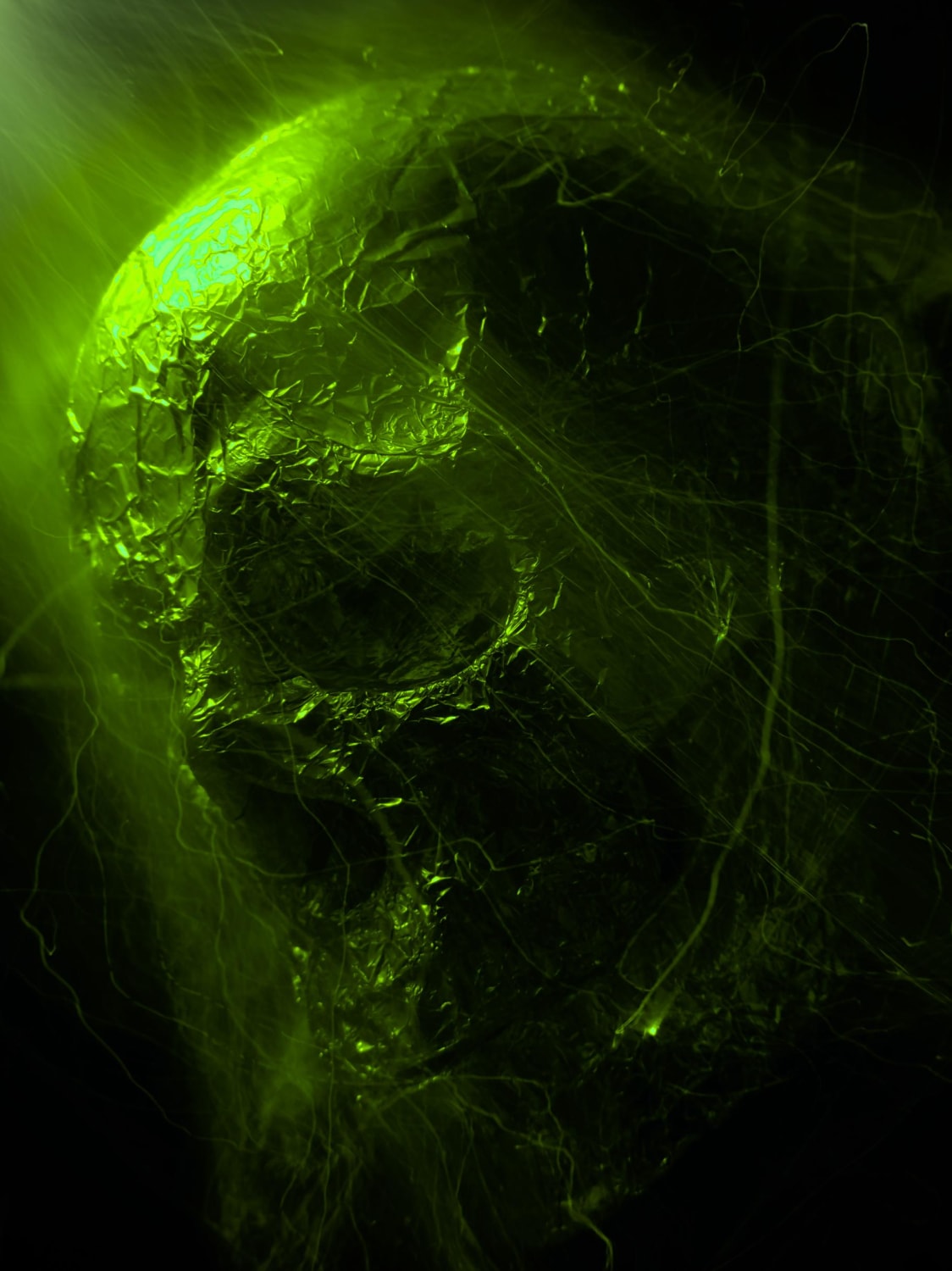 Light painting portrait of plastic human skull with baking foil on it. Exposure time 18s, iso 100. Made in pro mode in Xiaomi mi 9t with system camera app.
