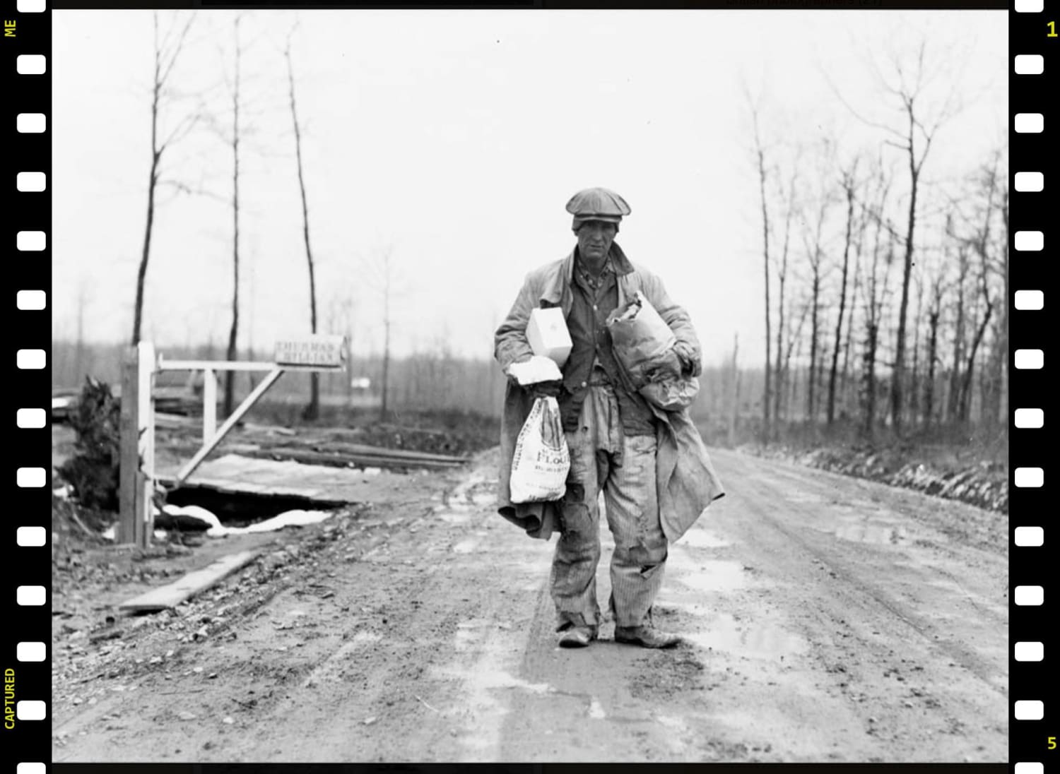 Farmer after shopping trip, Skyline Farms, Alabama, 1937. Photographer Arthur Rothstein.