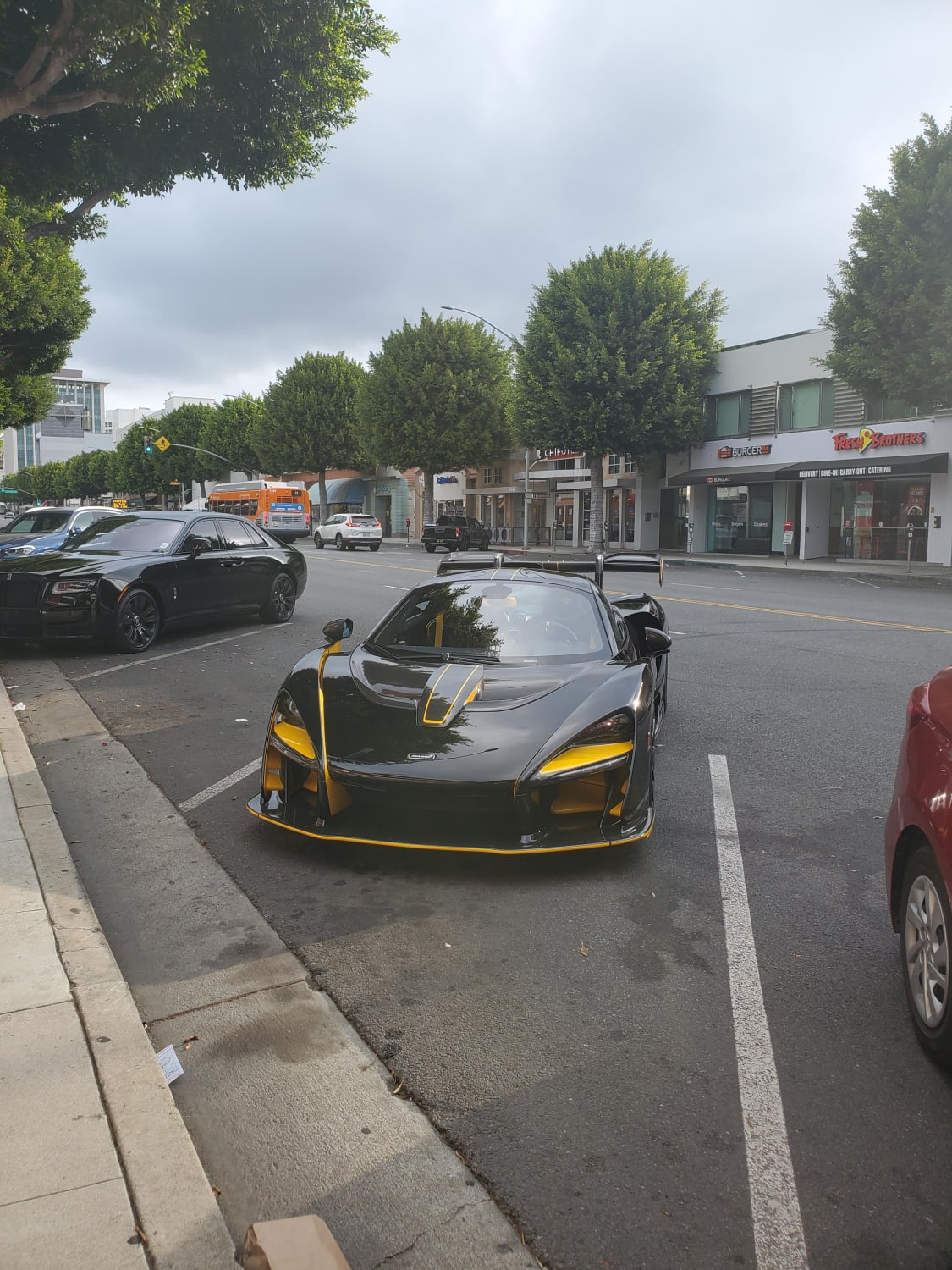 McLaren Senna with a casual Rolls Royce Ghost next to it, 2 for 1