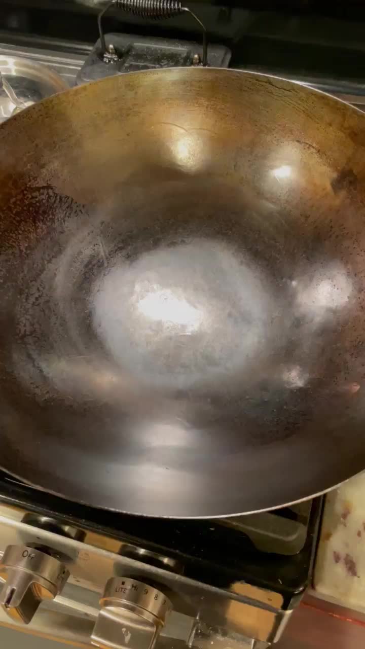 Water evaporates right? 700+ degree wok and water