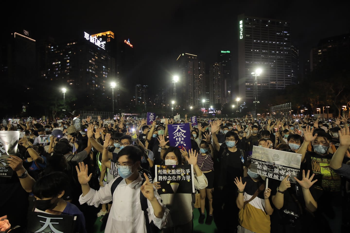 Hong Kong people defy ban on Tiananmen vigil to honor massacre victims