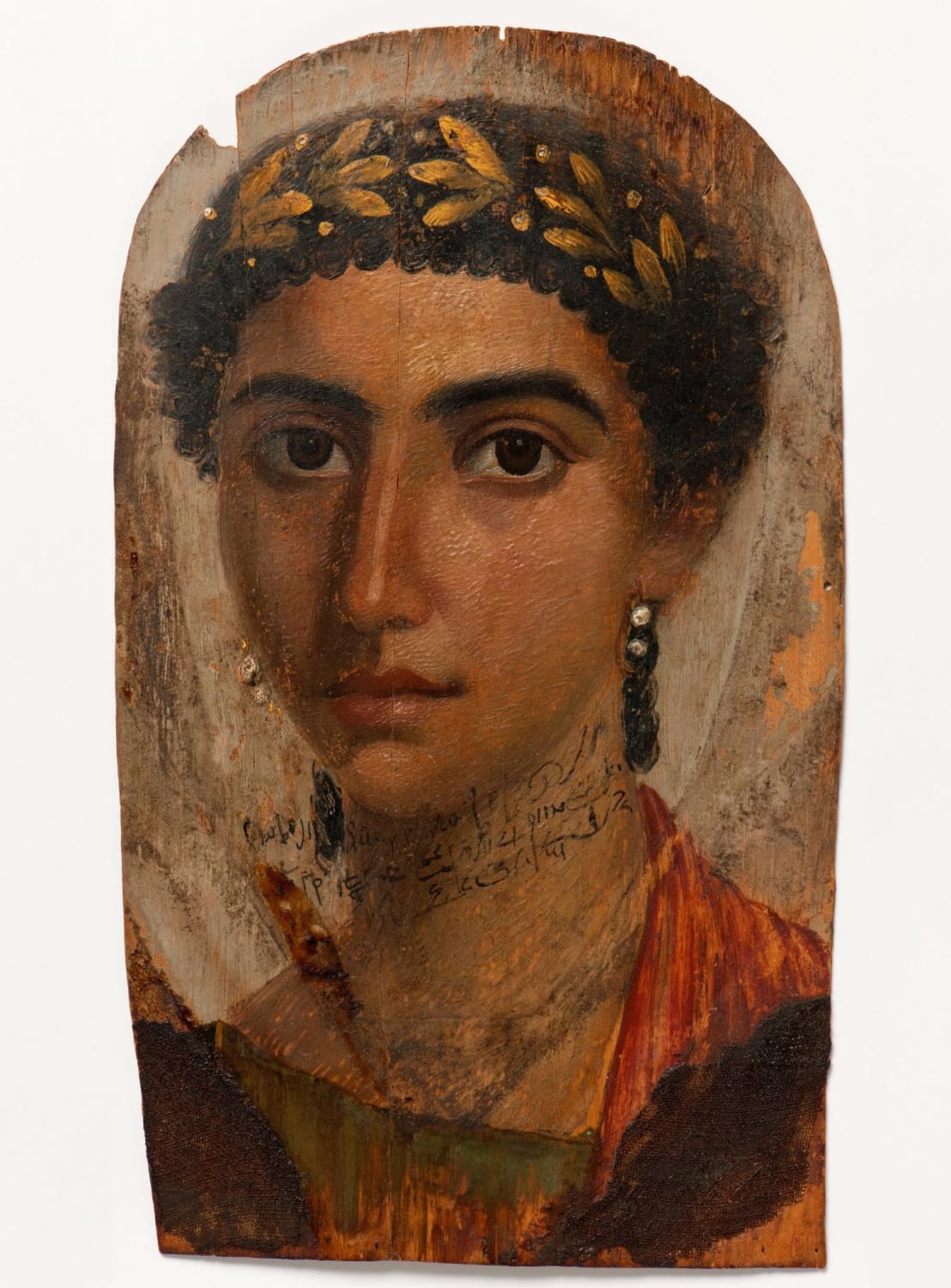 Mummy portrait of a woman named Eirene, with Demotic inscription. Egypt, 40-50 AD