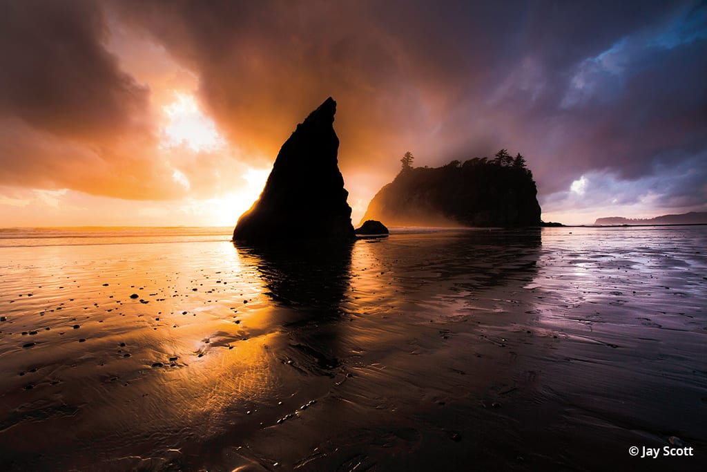 Ruby Beach, located in Olympic National Park in Washington State, features unique rock formations and is idyllic for sunset photography.