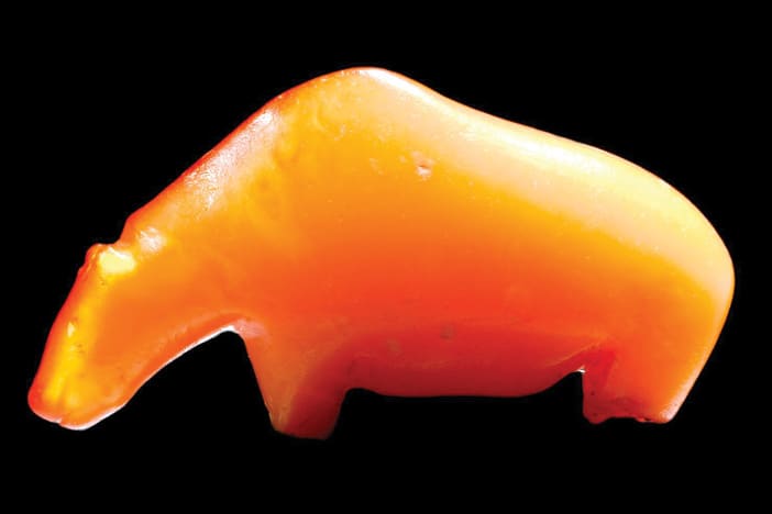 A beautiful Mesolithic amber figure of a bear. It washed up on a beach at Fanø in Denmark from a submerged Mesolithic settlement under the North Sea. 12500-3900 BC, now on display at the National Museum of Denmark