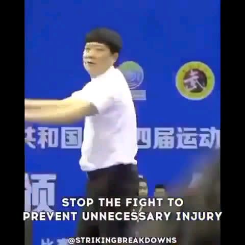 Referees taking blows to protect the fighters.
