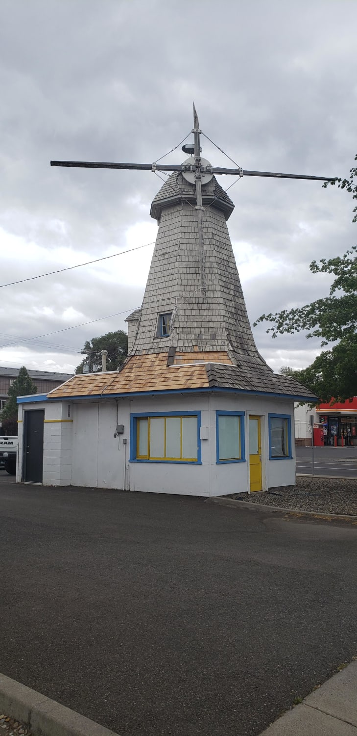 An abandoned windmill themed coffee shop.