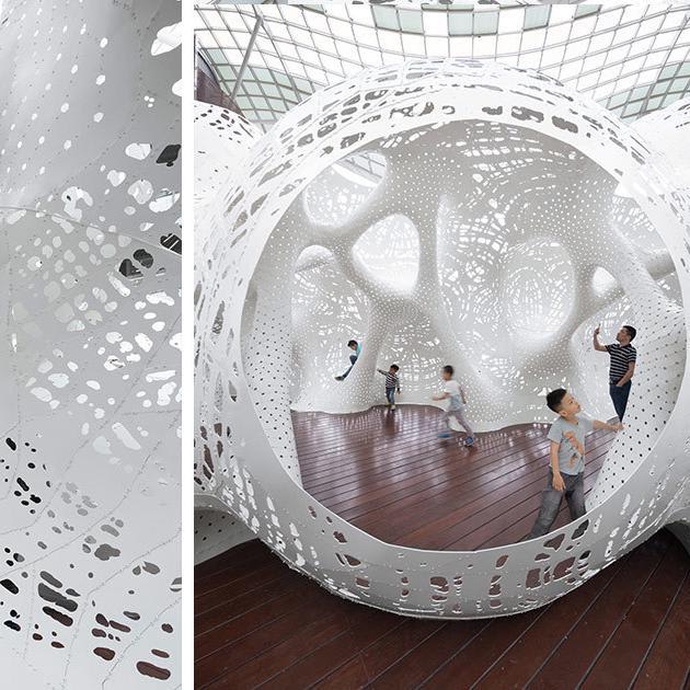 A Porous White Aluminum Sculpture Encourages Exploration and Play at the Jinji Lake Biennale