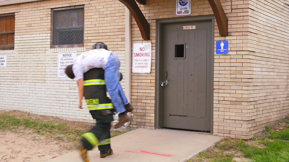 Firefighter Forgets To Put Down Man He Saved From Burning Building Before Entering Gas Station Bathroom