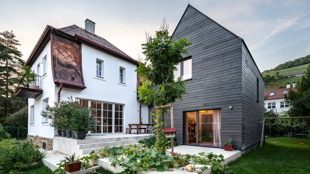 Smartvoll builds gabled timber-clad extension around old cottage in Klosterneuburg