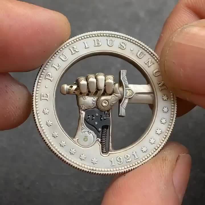 An old US dollar coin was transformed into a mechanical sculpture