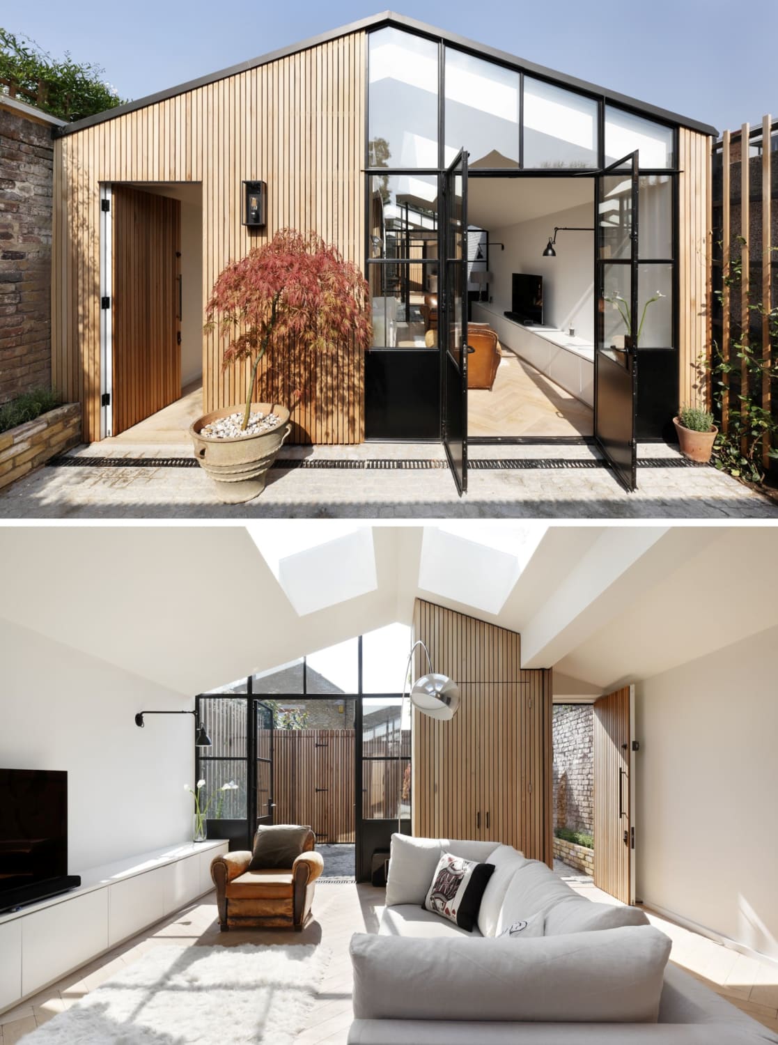 Living room with skylights in a former timber shed turned house, London, UK by De Rosee Sa