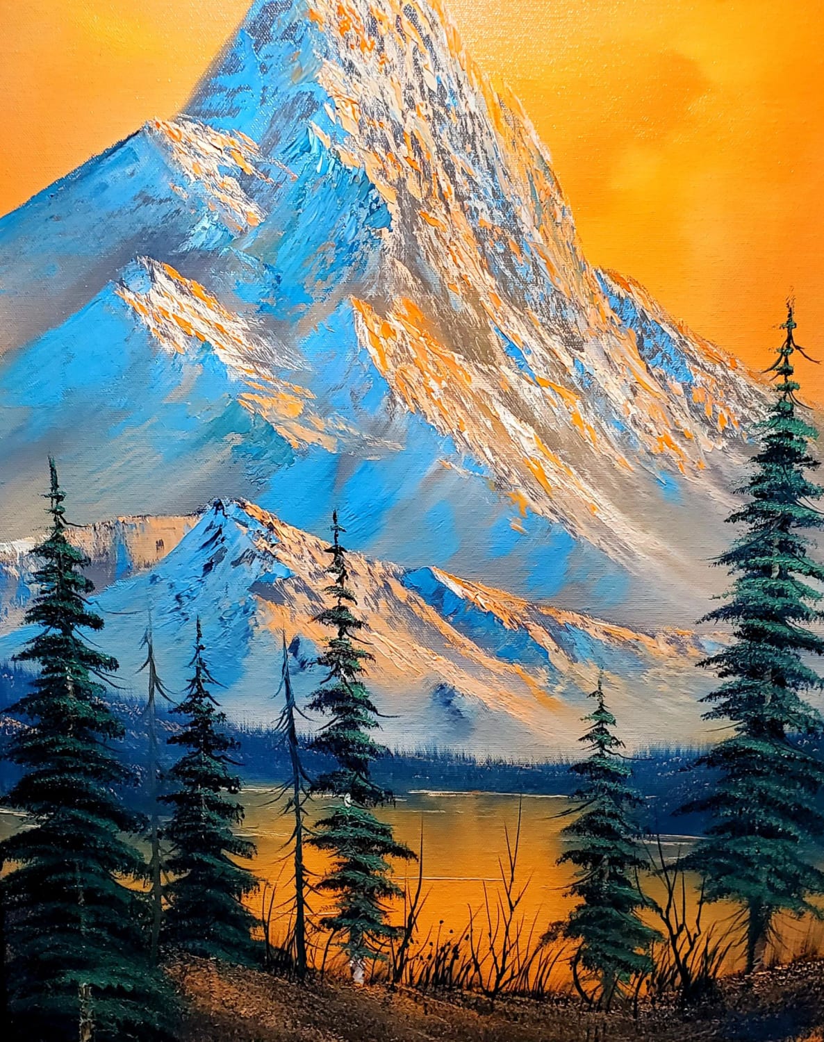 I am a certified Bob Ross Instructor. Here's a picture of my last painting.