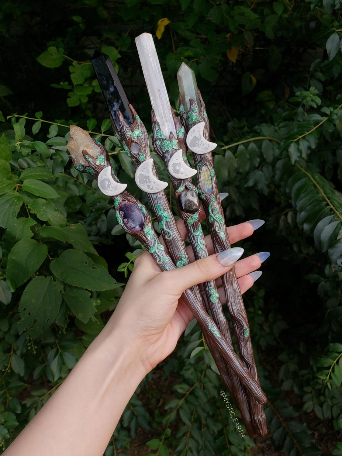 Some of my recent sculpted wands with genuine crystals