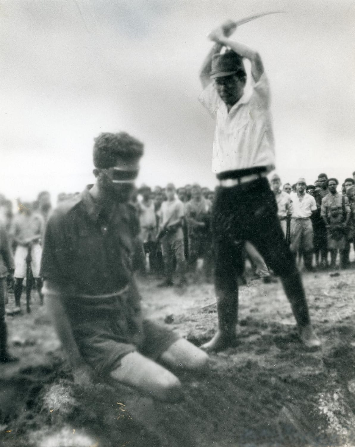 Australian Special Forces radio operator Leonard Siffleet about to be executed by a Japanese officer, Aitape Beach, Papua New Guinea, on October 24, 1943.