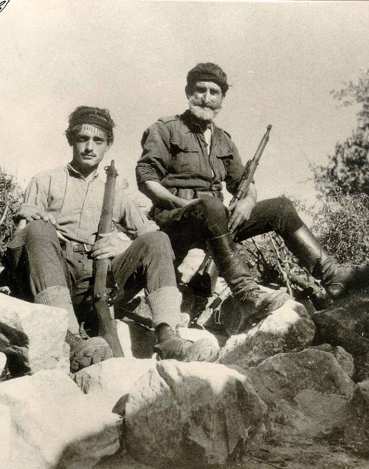 Crete, Greece, May 1941: Two armed Cretan civilians (probably father and son) during the Nazi invasion. German losses were more than 8.000 dead, wounded and missing, due to the fierce resistance from islanders and British Commonwealth troops.