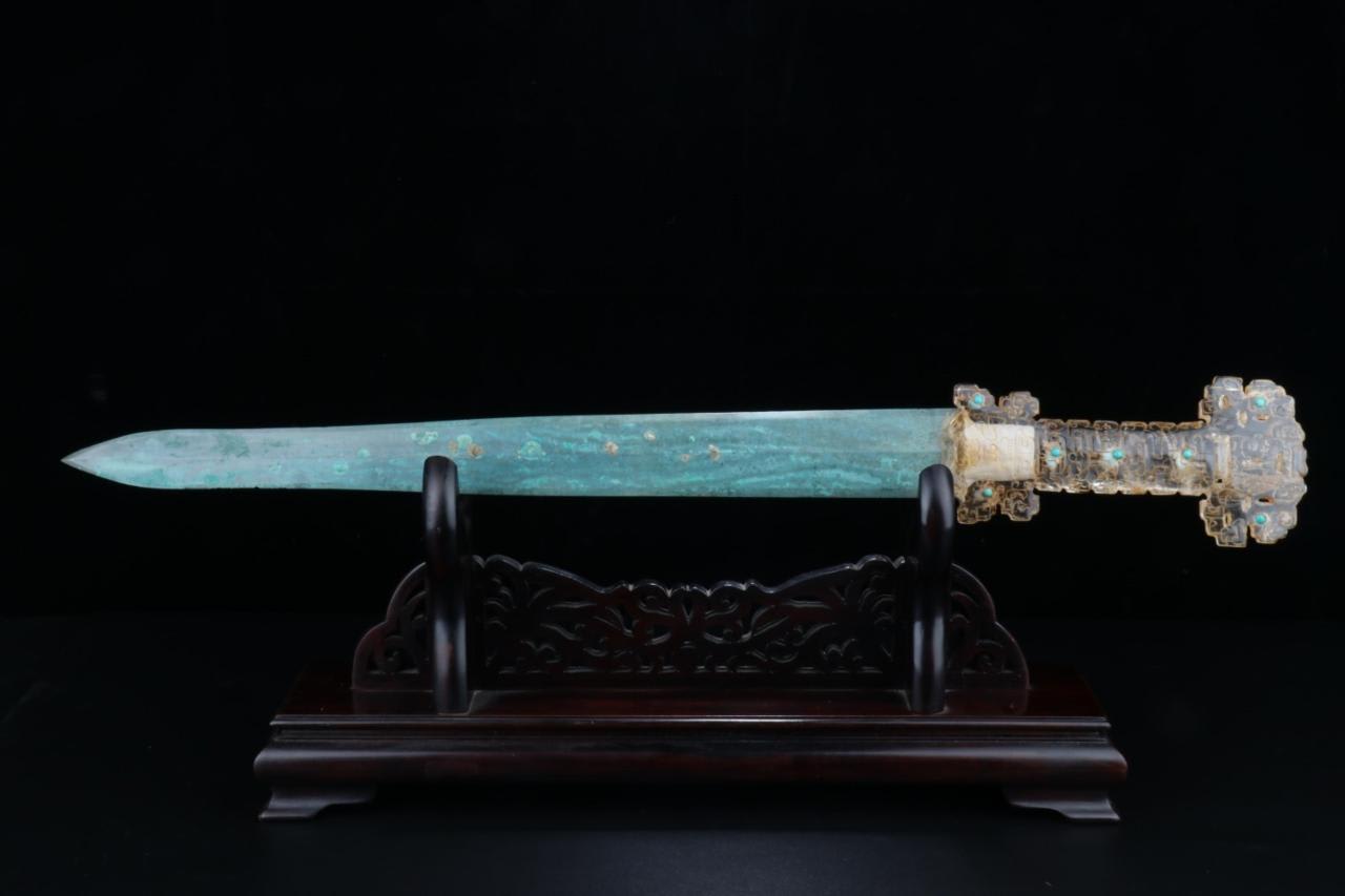 Chinese bronze sword with gold inlaid rock crystal hilt, turquoise studded. Warring States Period, 4th-2nd century BC.