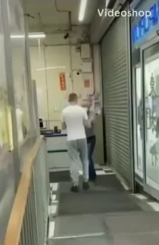 Racist dumbfuck harasses an Asian store. The owner knocks out the racist with one punch.