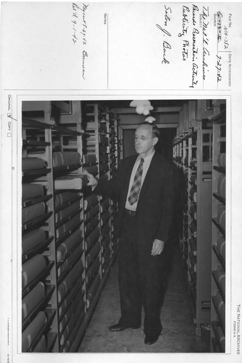 After the 1941 attack on Pearl Harbor, the BillOfRights was prepared for an emergency evacuation. Archivist of the United States Solon J. Buck stands with a volume containing the Bill of Rights, wrapped for “quick removal.”