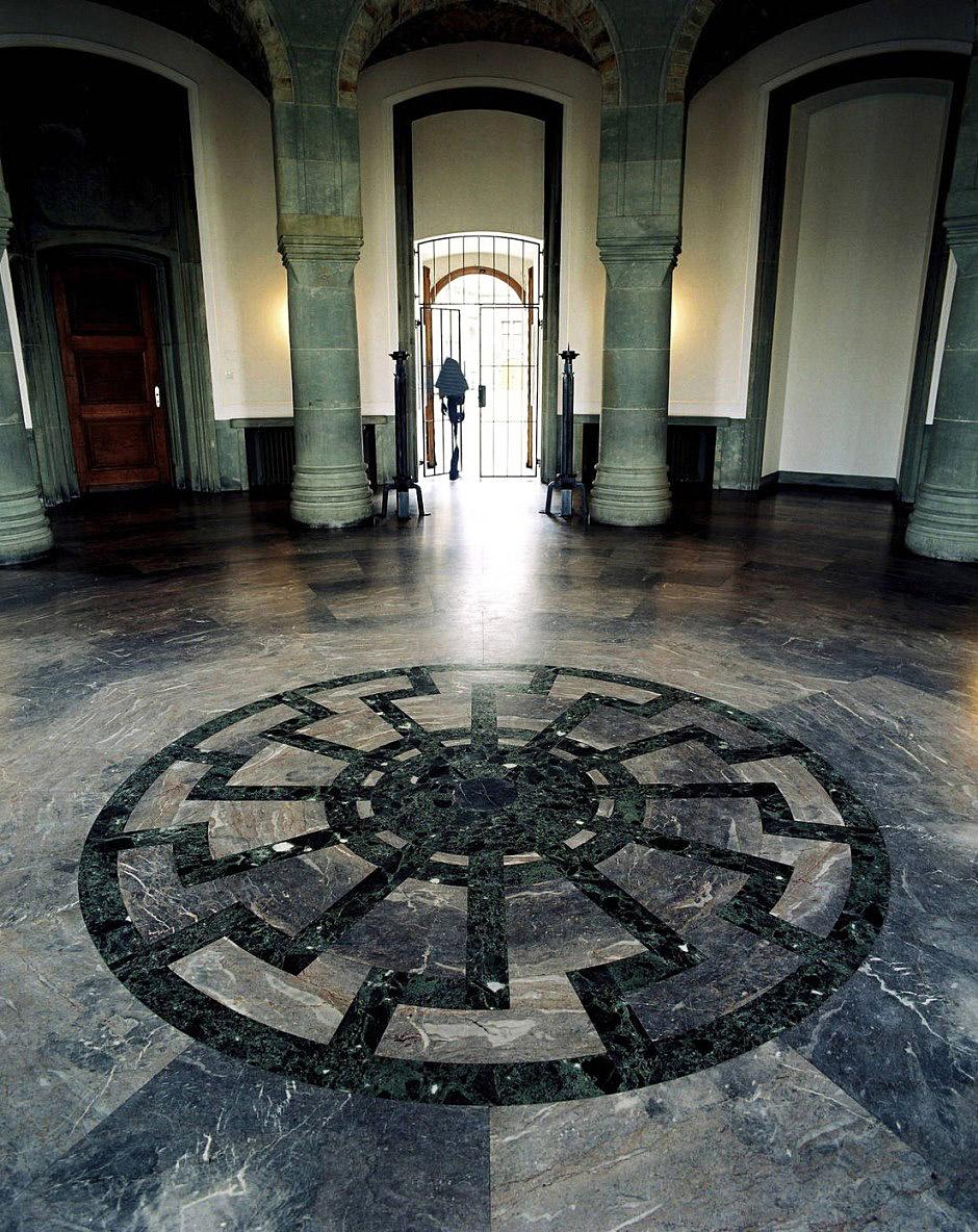 The black sun mosaic in the Obergruppenführersaal, or General's Hall at Wewelsburg Castle, often dubbed "the Nazi Camelot" or "the real Castle Wolfenstein". Wewelsburg is a 17th century castle that was heavily remodelled by Heinrich Himmler during the Nazi era.