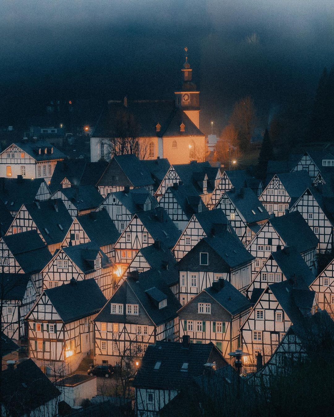 Winterly fog lifting over the timber framed houses in Monschau, Germany.