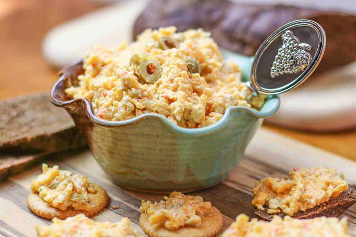 This easy homemade pimento cheese recipe has been passed down to me from my Great Grandmother. Unlike other pimento cheese spreads, this recipe includes olives.
