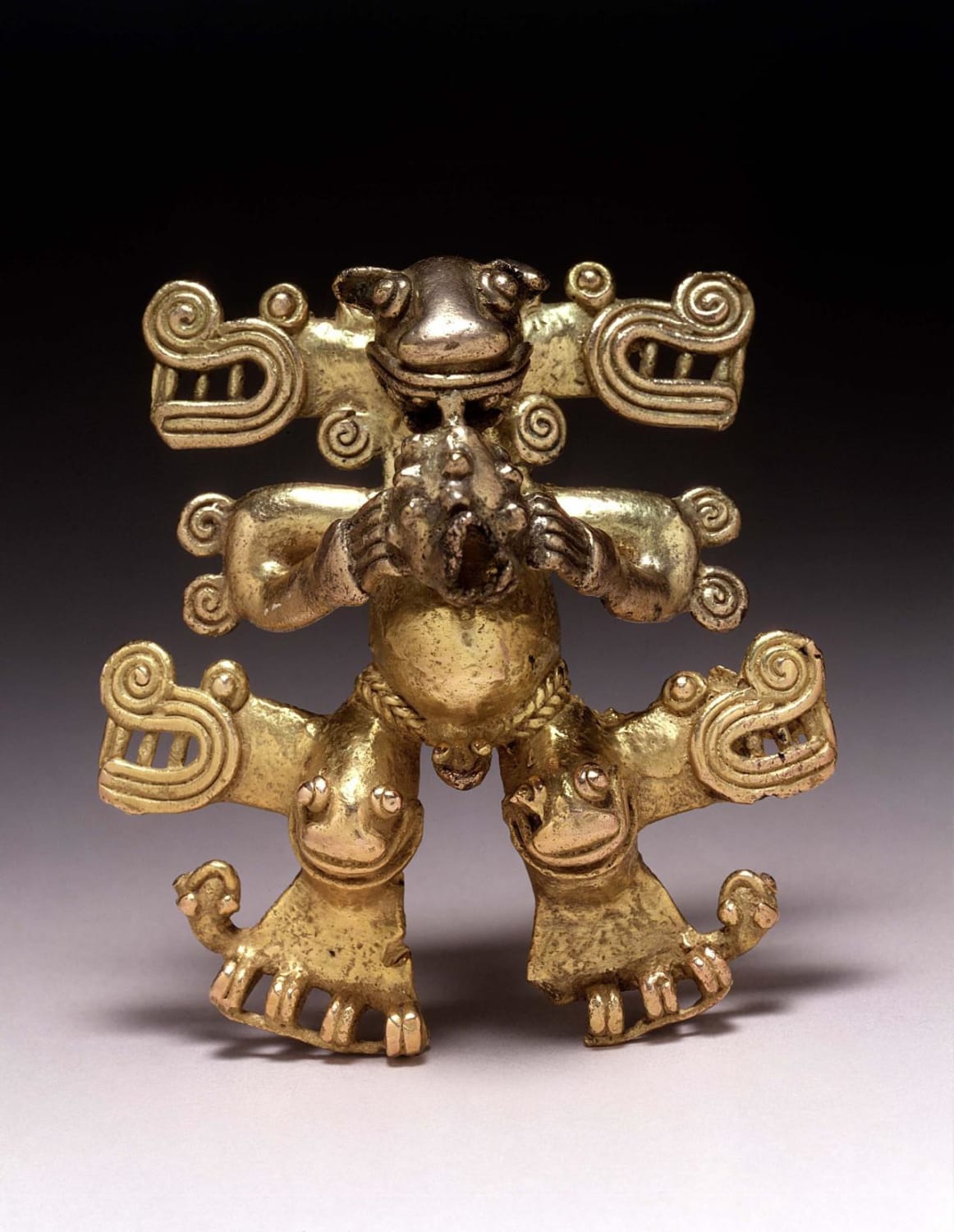 Gold pendant featuring a masked figure blowing a conch shell 'trumpet', Diquis-Chiriqui (Costa Rica/Panama), 700-1500, from Dumbarton Oaks Museum.