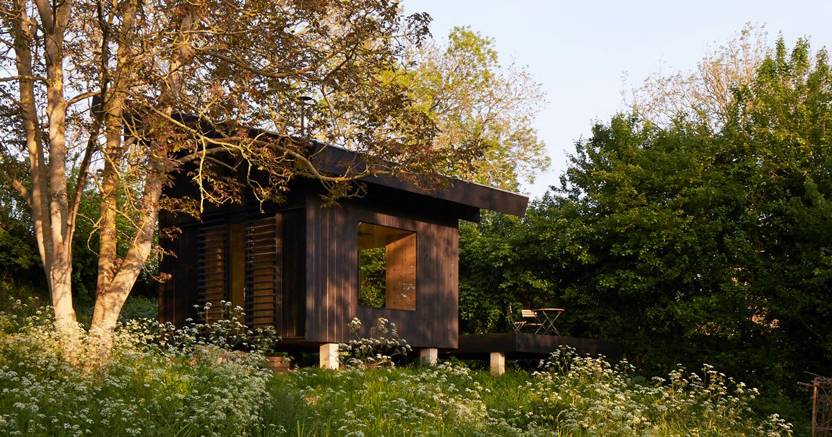 arba designs a 20sqm wooden house to inhabit a french garden in normandy