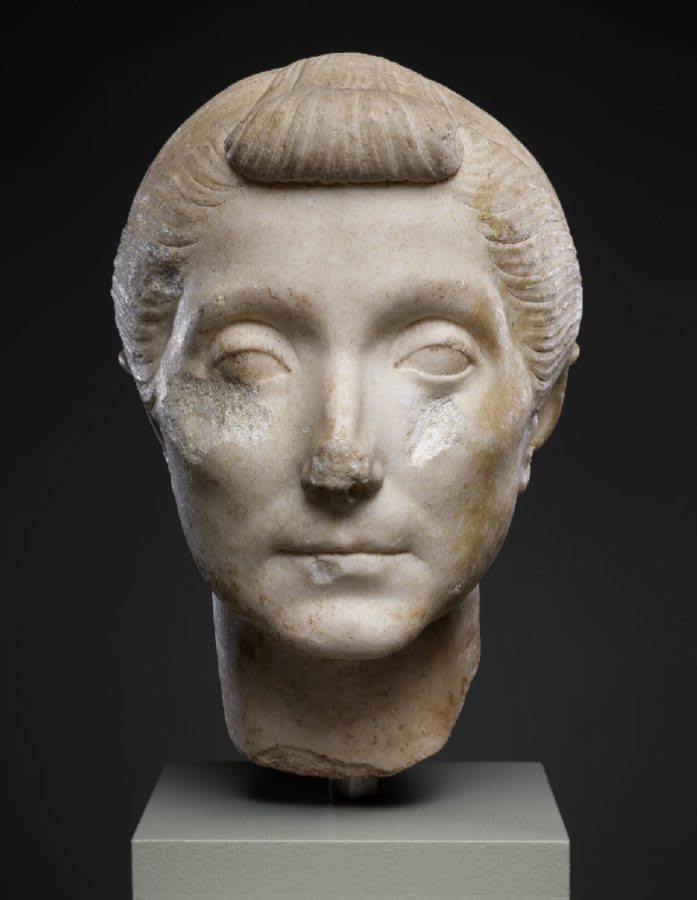 A marble bust of an elderly Roman woman with a characteristic hairstyle - the so-called *nodus*. Object dated at the end of the 1st century BCE.
