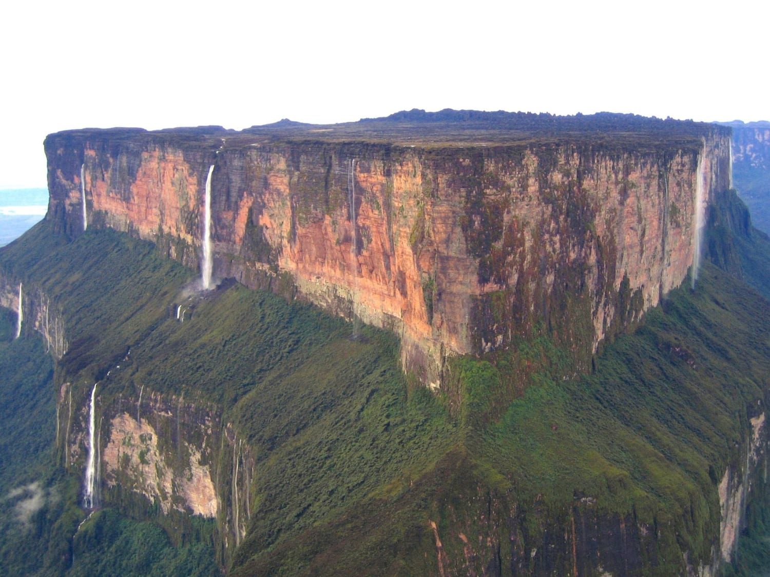 Mount Roraima - Tripoint of Venezuela, Guyana and Brazil, SA - The highest of the Pakaraima chain of table-top mountains in South America - 31 sq. kilometre/12-square-mile summit area bounded on all sides by cliffs rising 400 metres/1,300 ft - First described by Sir Walter Raleigh 1595