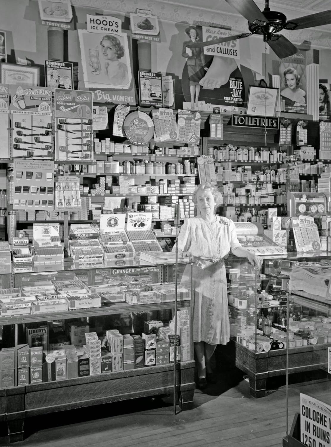 Southington, Connecticut. Mrs. Ethel Oxley, in the drugstore which she runs on the town's main street. Her family has had a business on this same corner for more than 200 years. May 1942.