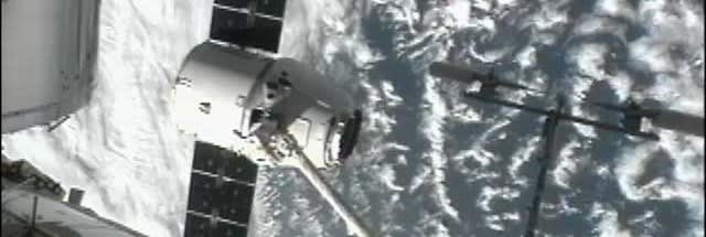 SpaceX Dragon capsule berths with space station