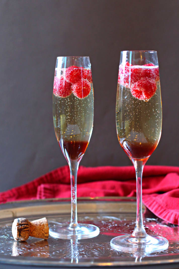 Prosecco cocktail made with Chambord Raspberry Liqueur and fresh raspberries.