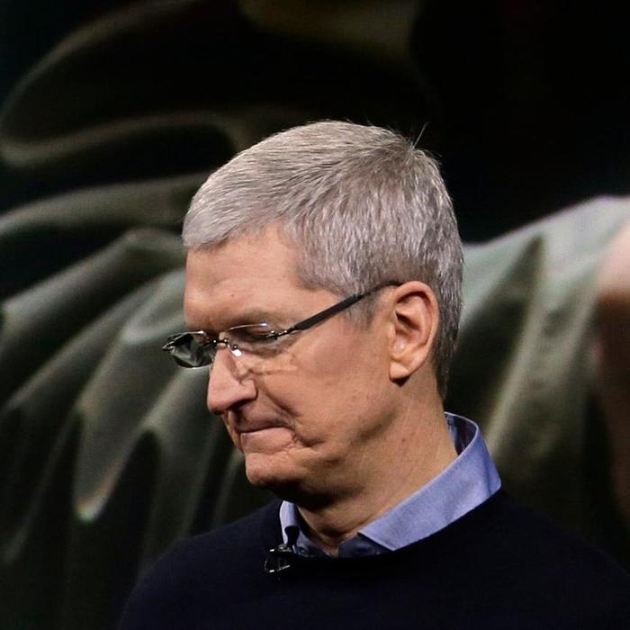 Tim Cook said Apple will reduce hiring in certain divisions because of the iPhone sales slowdown