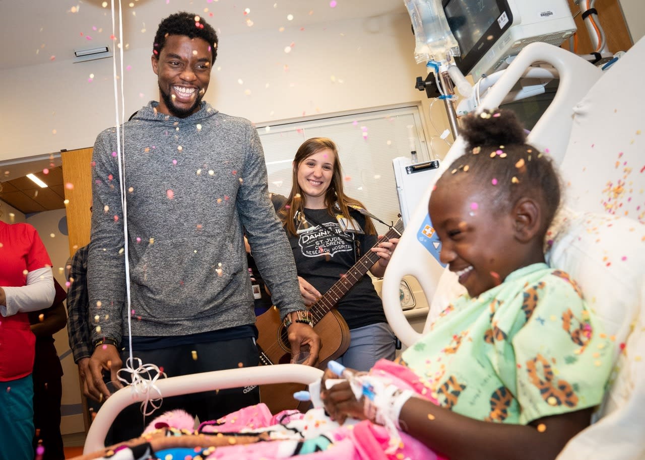 Chadwick Boseman visiting Mady at St Judes Children's Hospital in 2018