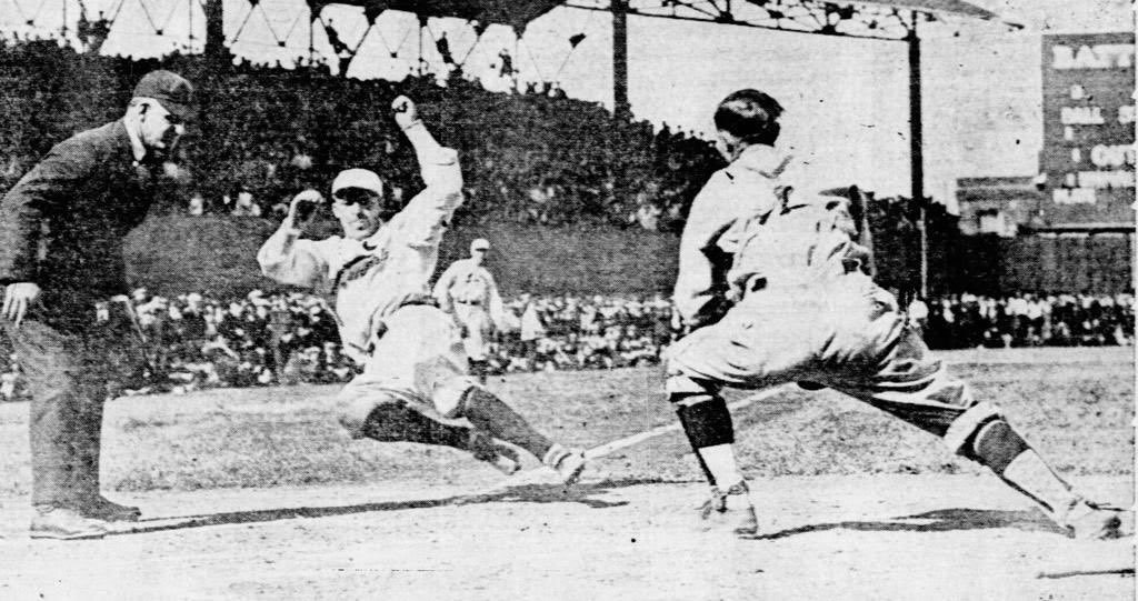Jim Bottomley of the St. Louis Cardinals is thrown out at the plate in an exhibition game against the St. Louis Browns, a local team.