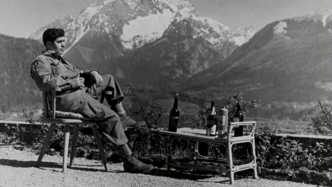 American paratrooper drinks Hitler’s cognac on his patio as the Allies occupy his Alpine retreat at Berchtesgaden, 1945