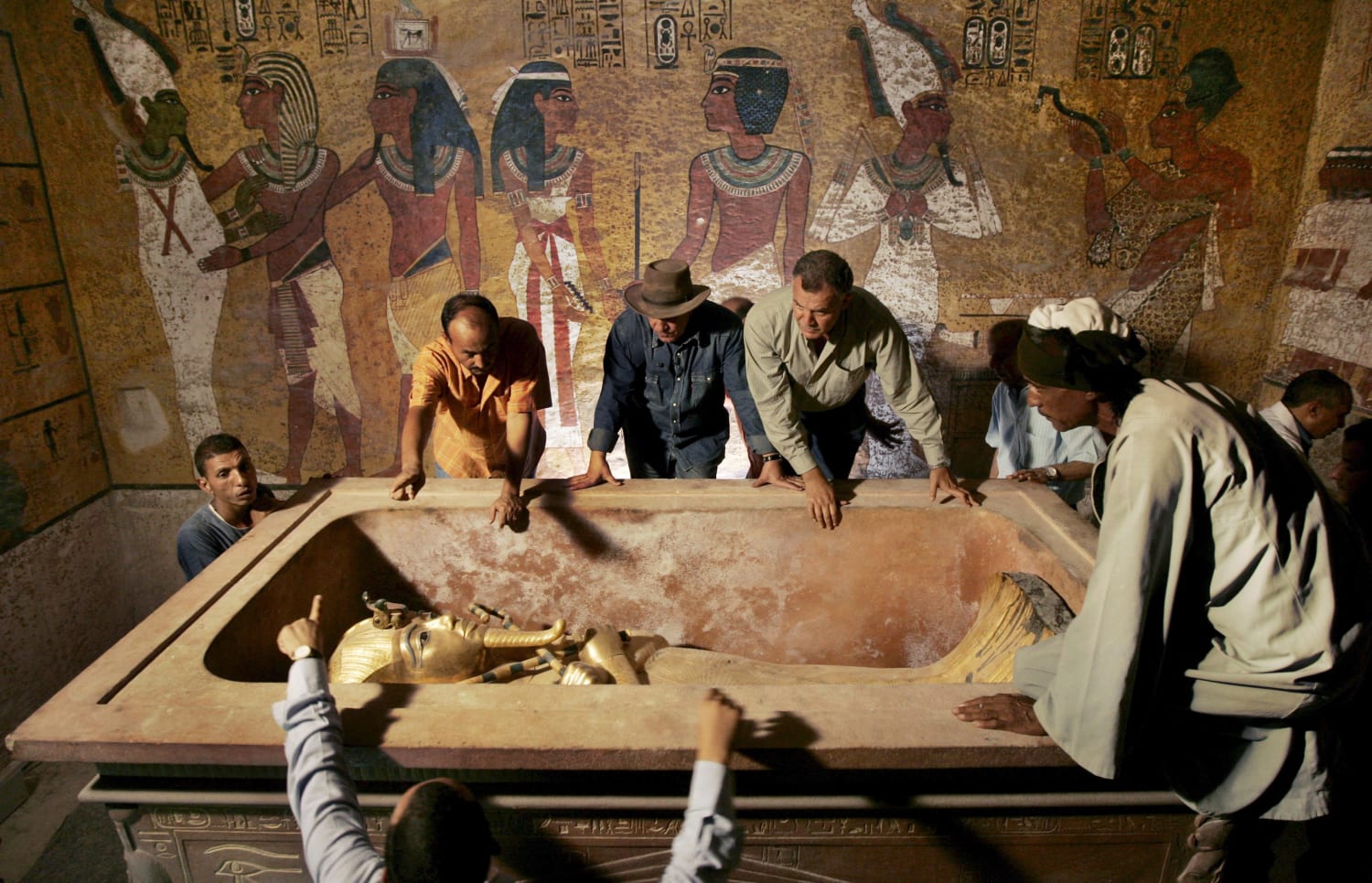 Archaeologists supervising the removal of King Tut