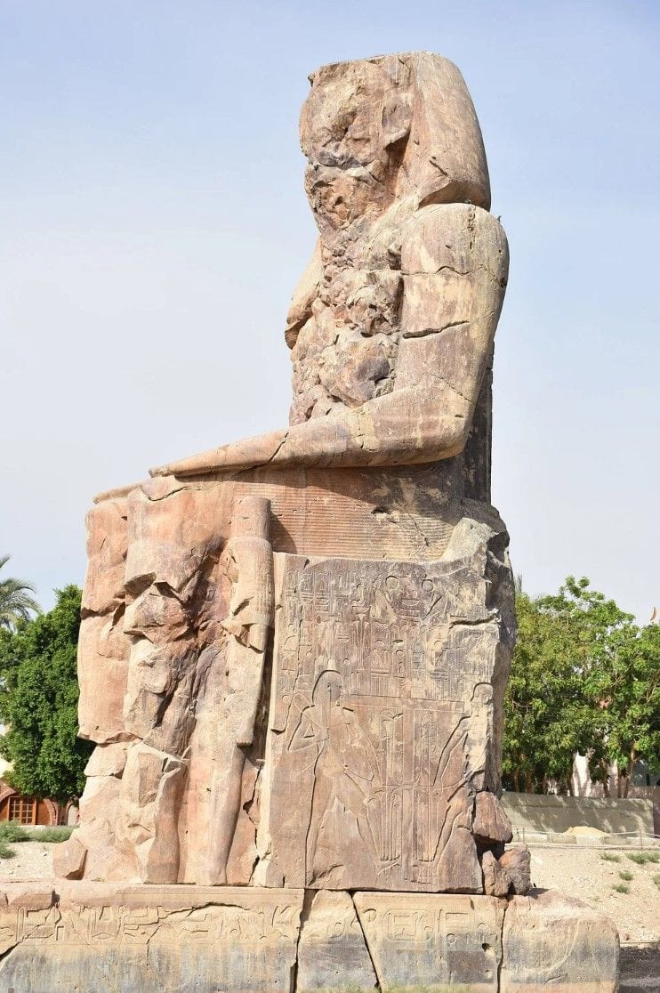 One of the Colossi of Memnon representing Amenhotep III, 18th Dynasty ...